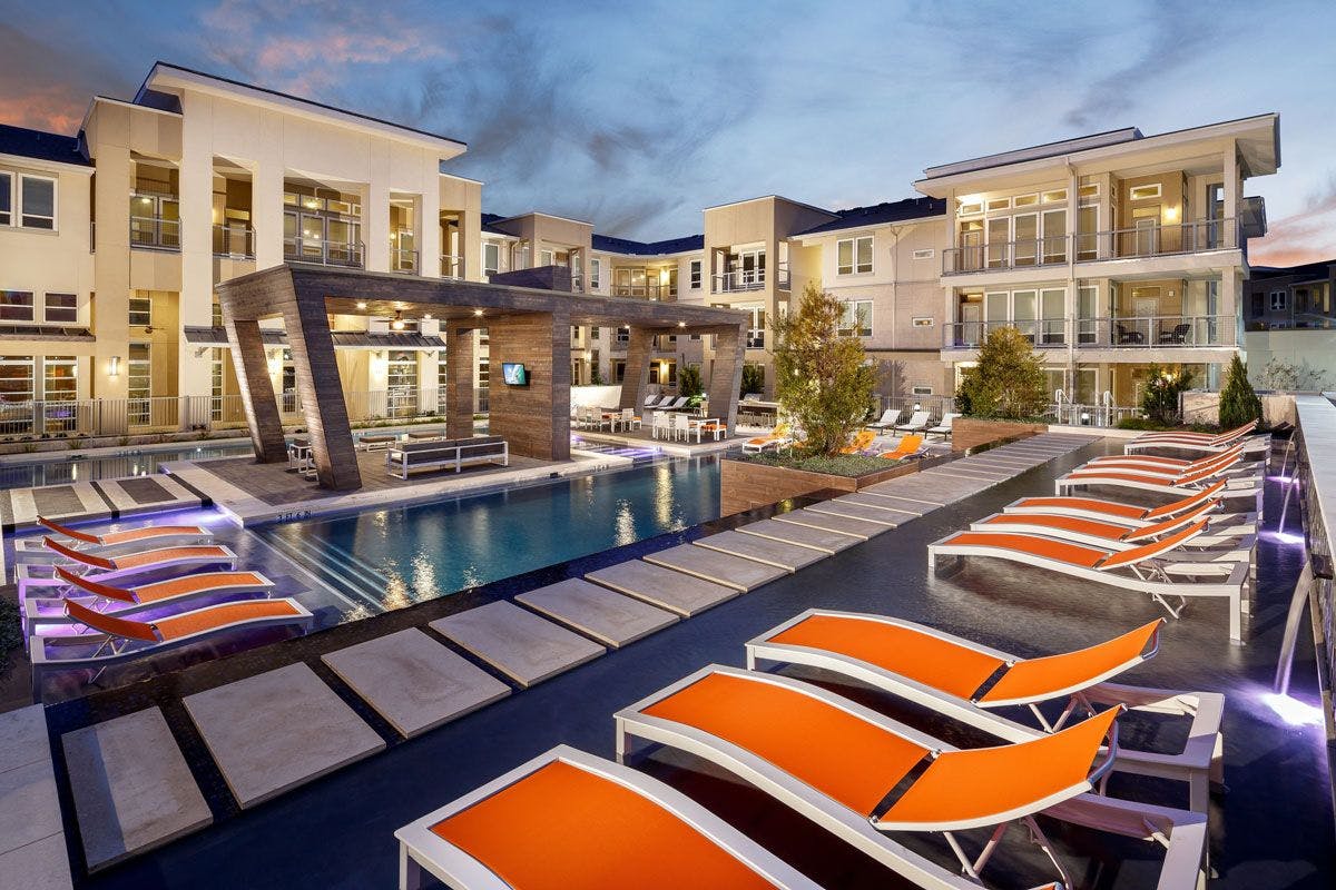 Pool with orange lounge chairs